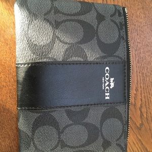NWT Coach wristlet. BlackSmoke/Black combo. Signature pattern. Ready to gift.